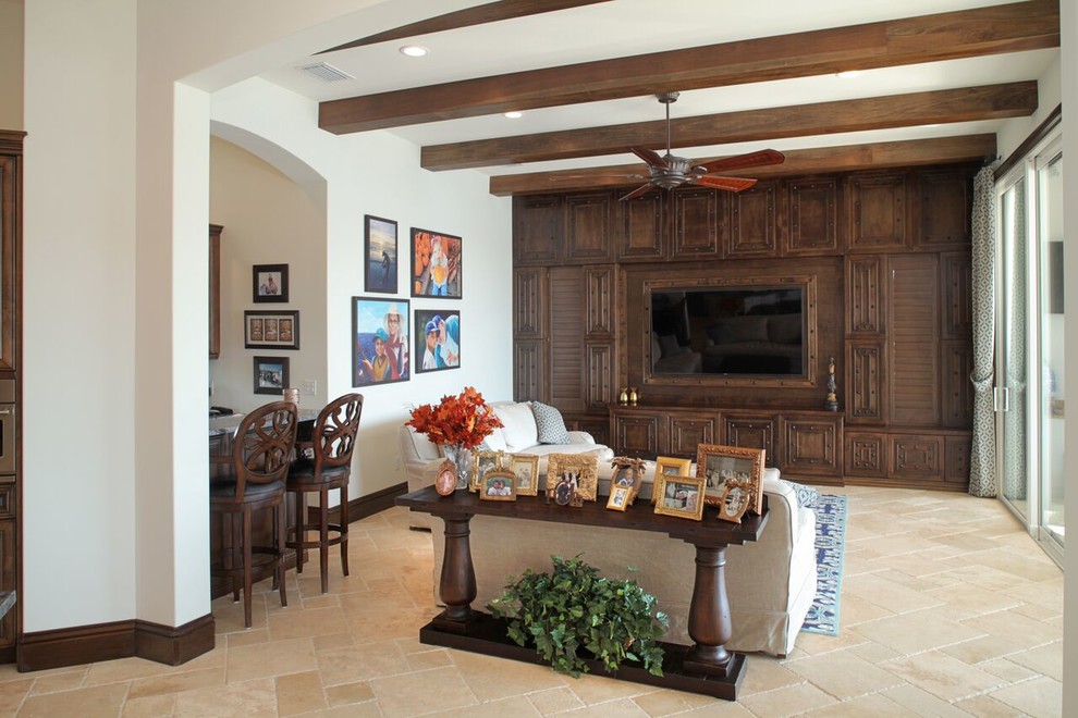 Inspiration for a large mediterranean open plan games room in Tampa with a home bar, white walls, travertine flooring, no fireplace and a built-in media unit.