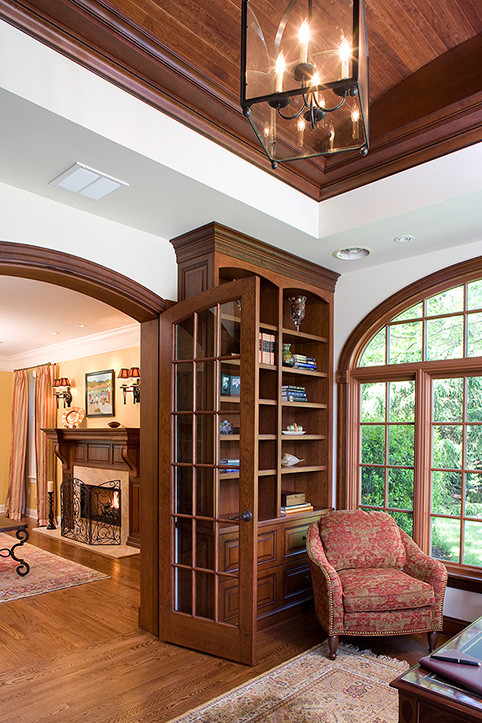 Inspiration for a classic enclosed games room in New York with a reading nook, white walls and medium hardwood flooring.