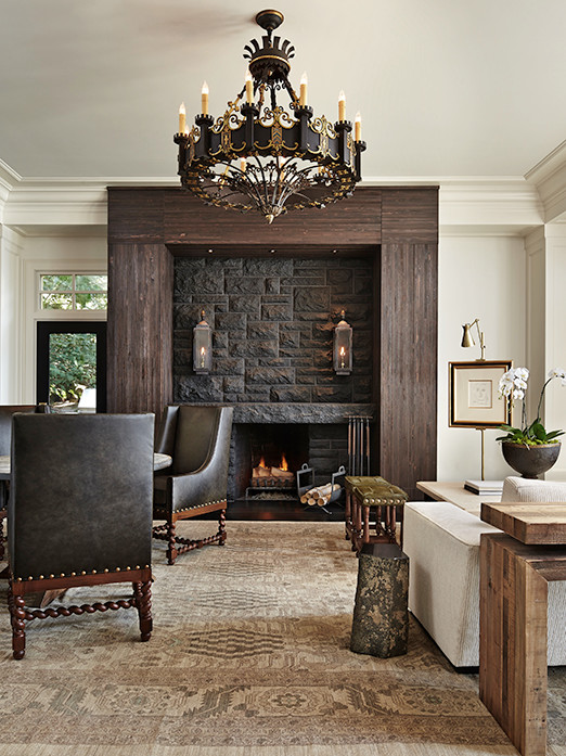 Inspiration for a bohemian games room in Seattle with white walls, dark hardwood flooring, a standard fireplace and a stone fireplace surround.
