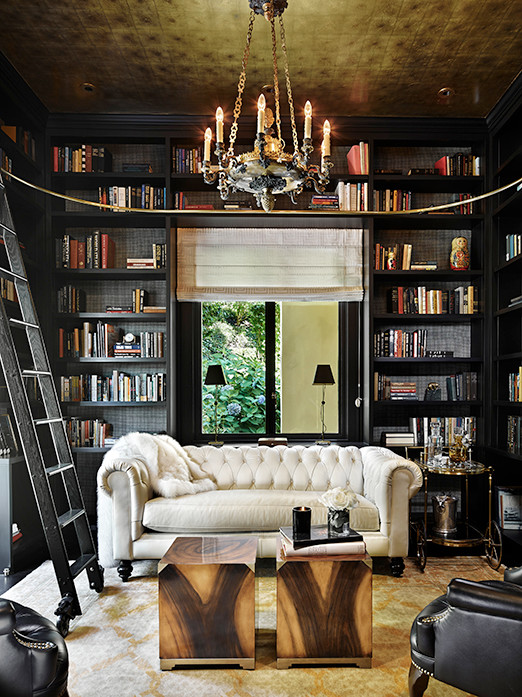 Example of an eclectic dark wood floor family room library design in Seattle with black walls