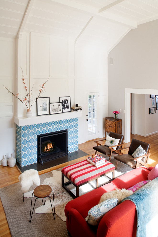 Inspiration for a mid-sized contemporary open concept medium tone wood floor family room remodel in Los Angeles with white walls, a standard fireplace and a tile fireplace