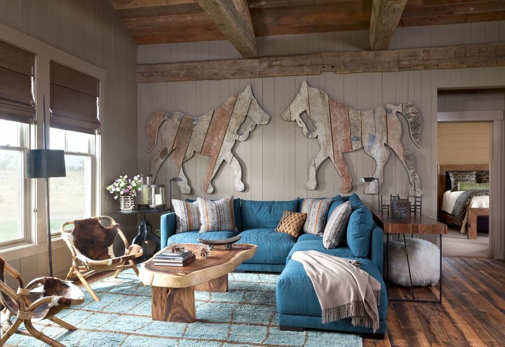 Inspiration for a rustic medium tone wood floor family room remodel in Atlanta with gray walls