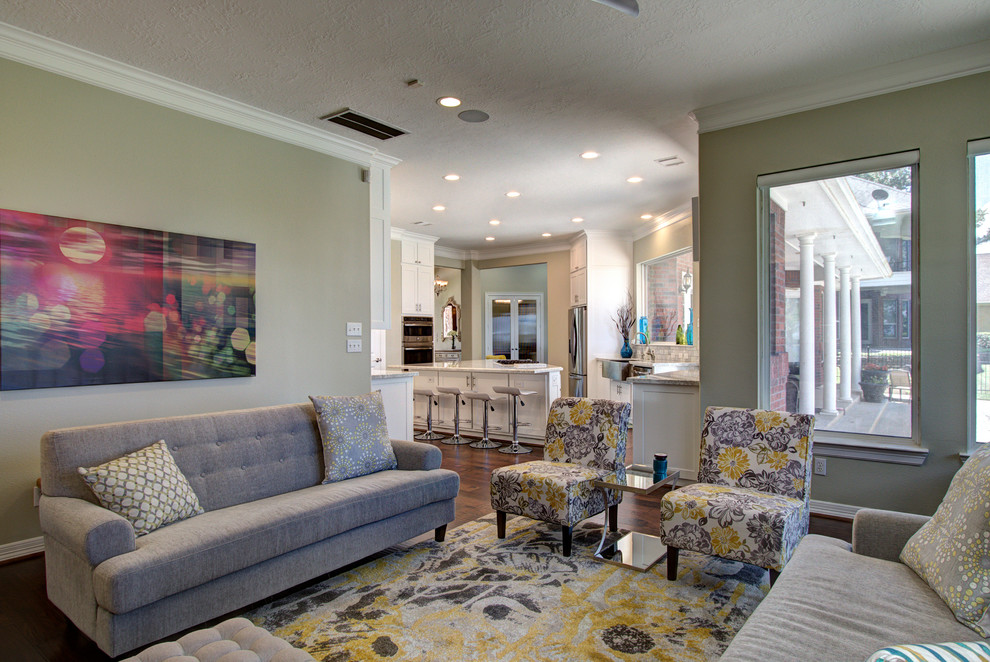 Large eclectic open plan games room in Houston with green walls, medium hardwood flooring, a standard fireplace, a tiled fireplace surround and a wall mounted tv.