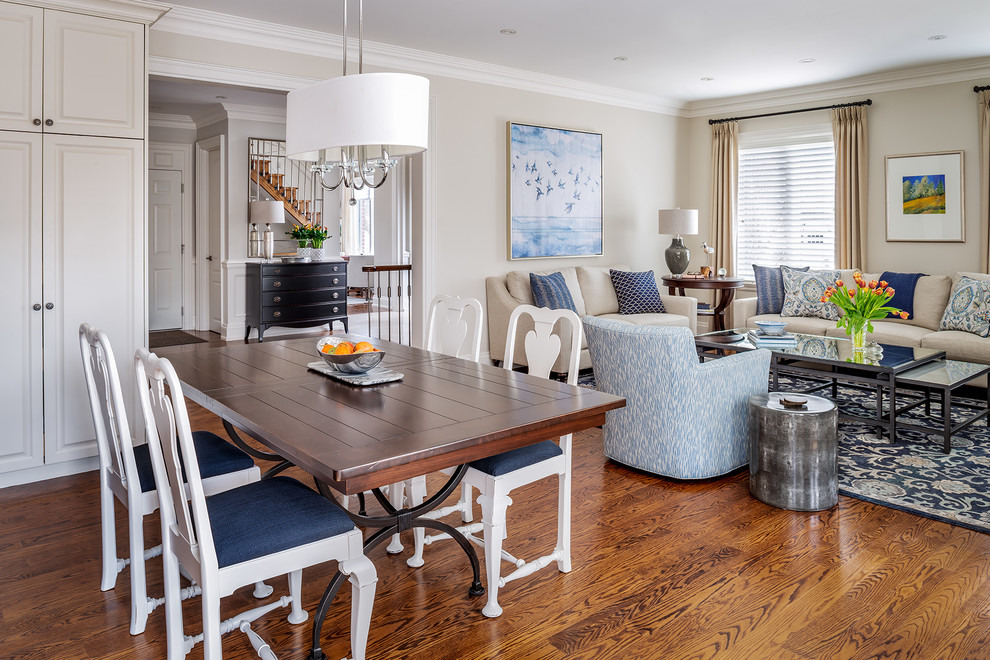 Mid-sized elegant open concept medium tone wood floor and brown floor family room photo in Toronto with beige walls