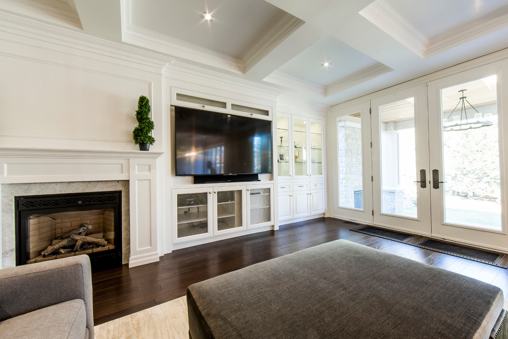 Family room - large transitional open concept dark wood floor family room idea in Toronto with gray walls, a standard fireplace, a wood fireplace surround and a wall-mounted tv