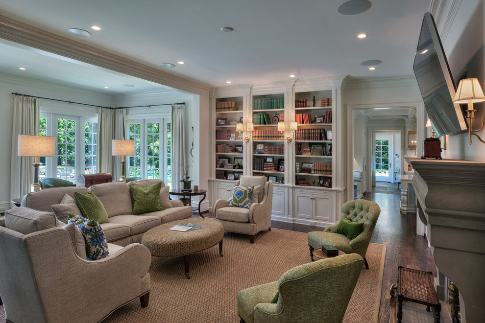 Example of a classic open concept dark wood floor family room library design in Other with white walls, a standard fireplace, a stone fireplace and a wall-mounted tv
