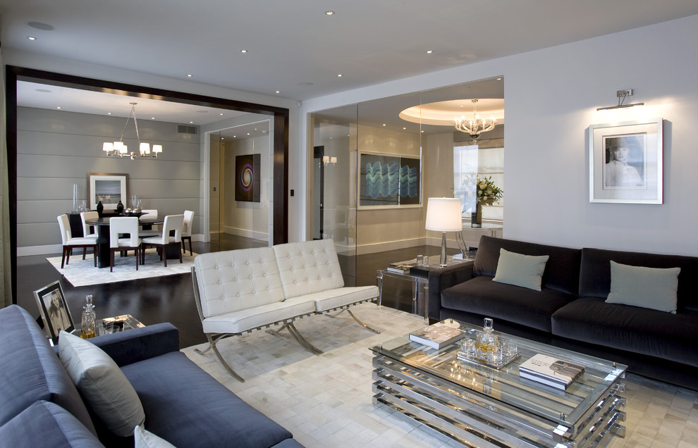 Immagine di un soggiorno contemporaneo aperto e di medie dimensioni con pareti bianche, parquet scuro, pavimento nero, nessun camino e tappeto