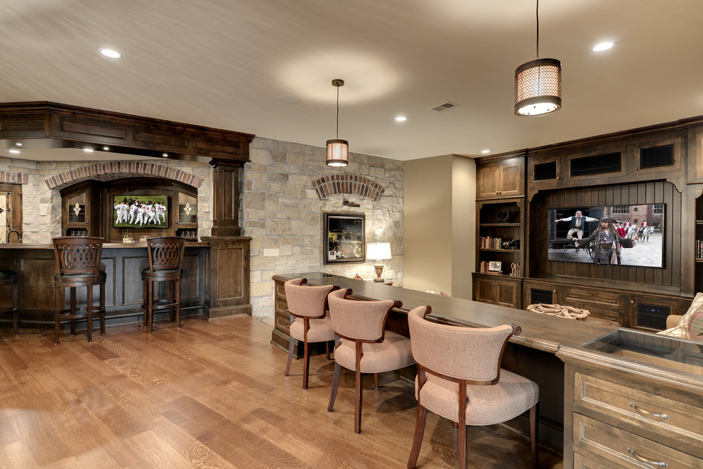 Elegant family room photo in Minneapolis with a bar