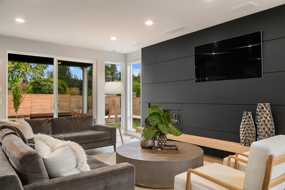 Modelo de sala de estar abierta actual con pared multimedia