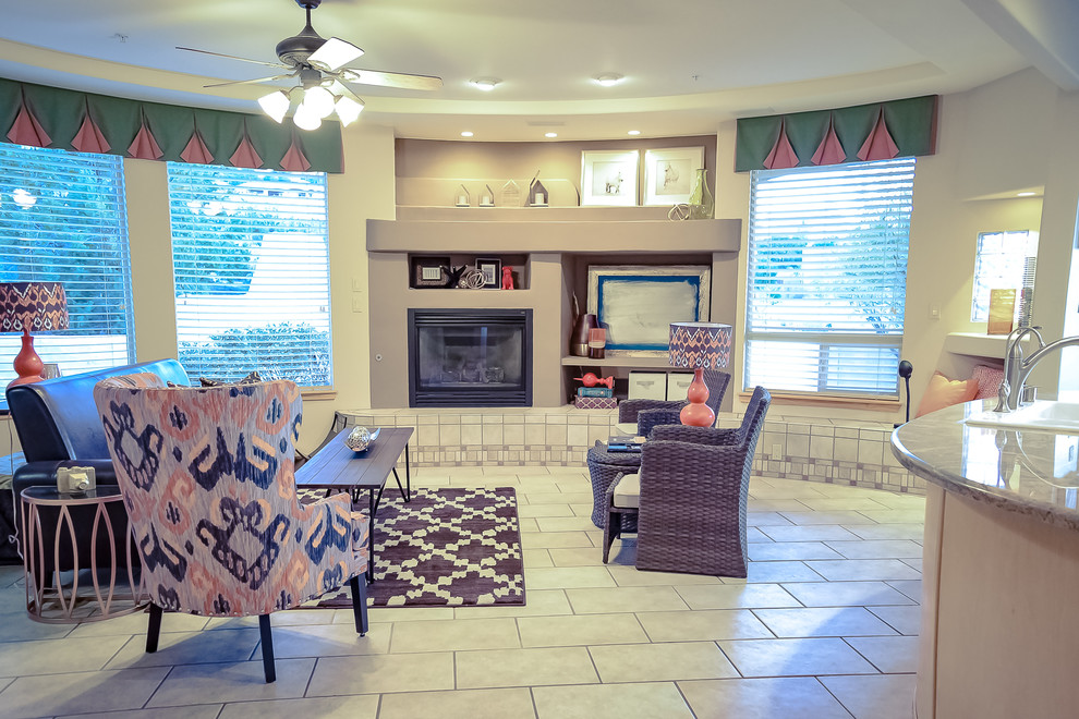 Design ideas for a medium sized traditional open plan games room in Albuquerque with beige walls, porcelain flooring, a standard fireplace, a plastered fireplace surround, a built-in media unit and multi-coloured floors.
