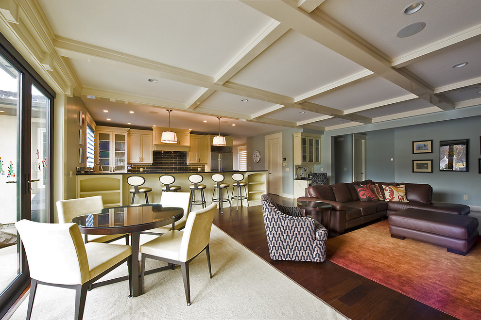 Inspiration for a contemporary brown floor family room remodel in Vancouver with blue walls