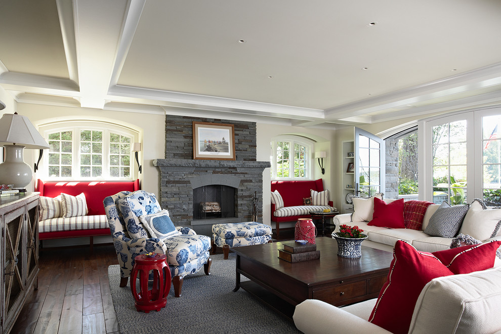Family room - traditional dark wood floor and brown floor family room idea in Minneapolis with beige walls, a standard fireplace, a stone fireplace and no tv