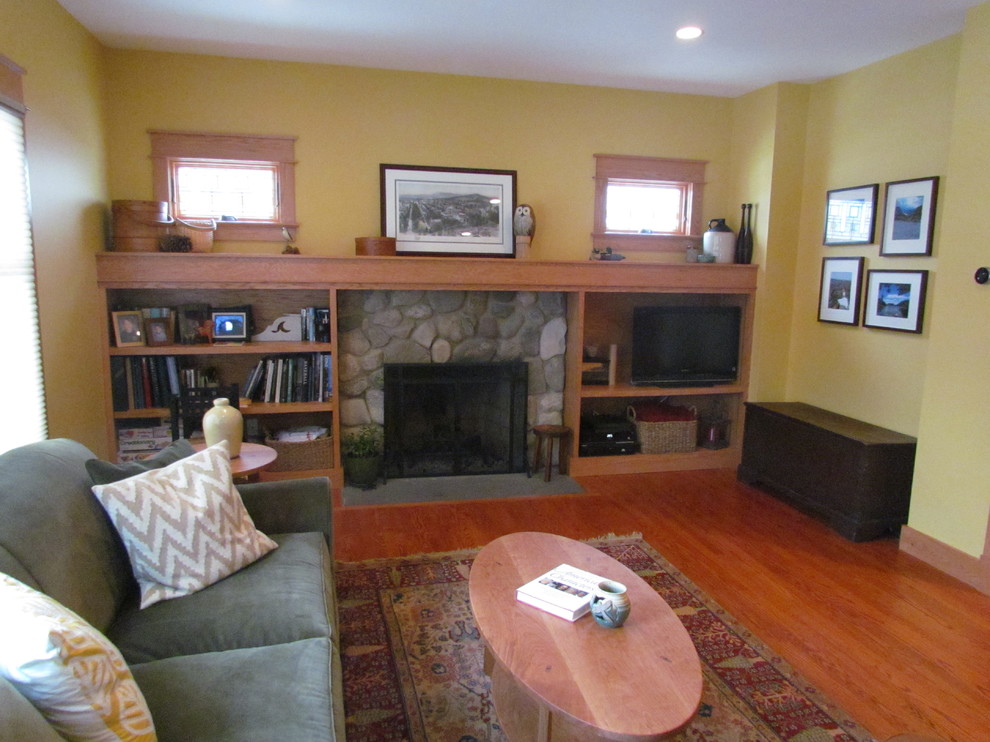 Family room - mid-sized craftsman open concept dark wood floor and brown floor family room idea in DC Metro with yellow walls, a standard fireplace, a stone fireplace and a media wall