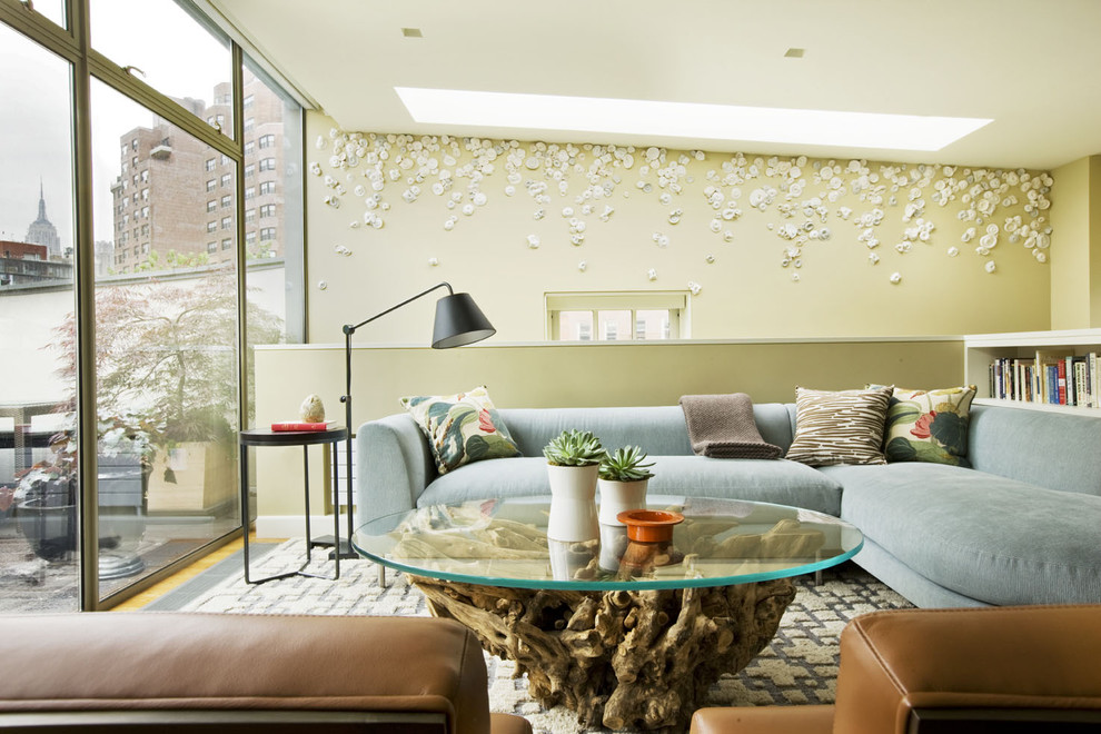 Example of a mid-century modern loft-style family room design in New York with beige walls