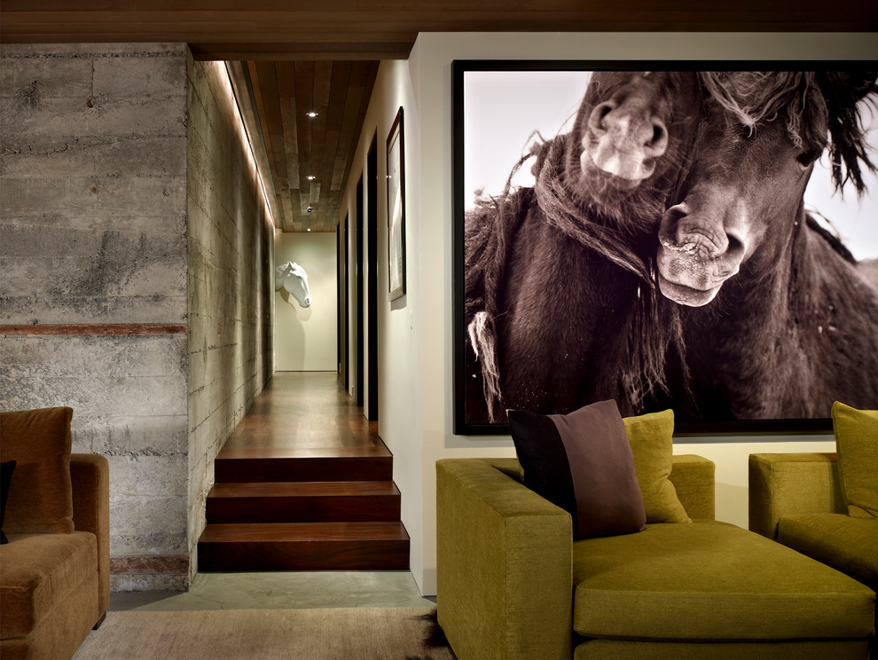 Medium sized contemporary enclosed games room in Seattle with concrete flooring, beige walls and grey floors.