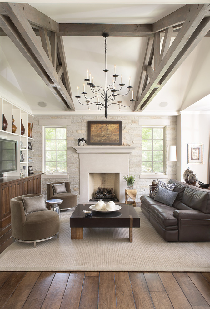 Elegant dark wood floor family room photo in Chicago with beige walls, a standard fireplace and a tv stand