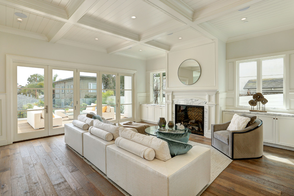 Inspiration for a large classic open plan games room in Los Angeles with white walls, medium hardwood flooring, a standard fireplace, a stone fireplace surround and no tv.