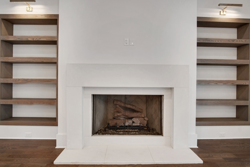 Inspiration for a large transitional open concept medium tone wood floor and gray floor family room remodel in Atlanta with white walls, a standard fireplace, a stone fireplace and a wall-mounted tv