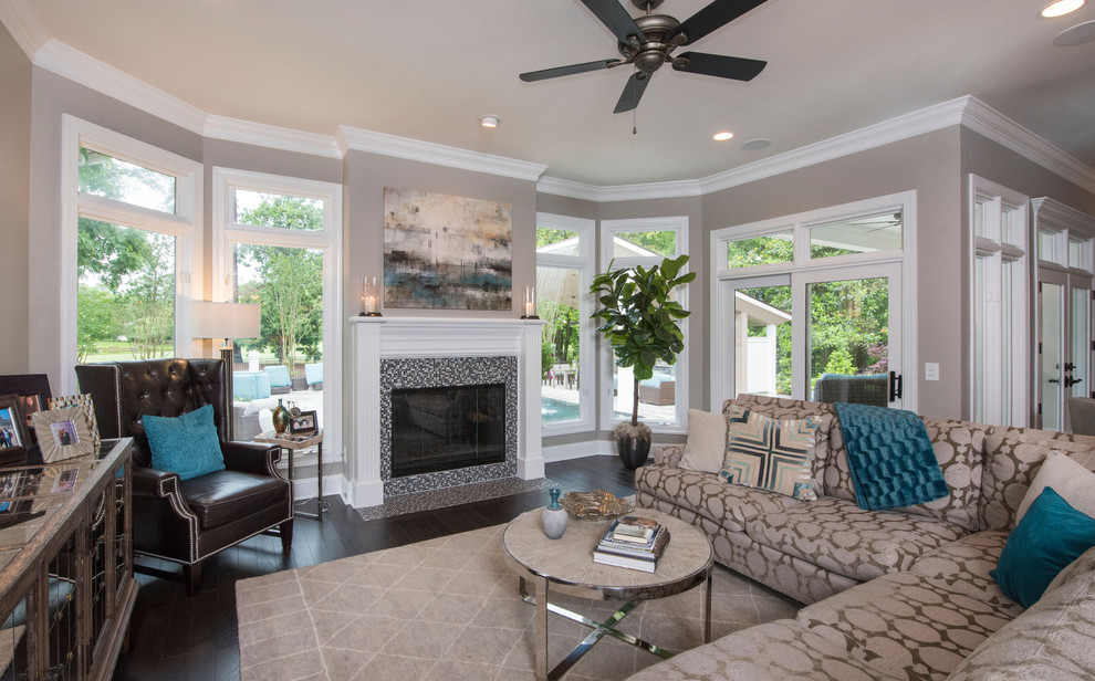 Inspiration for a medium sized classic games room in Raleigh with grey walls, dark hardwood flooring, a standard fireplace, a tiled fireplace surround and black floors.