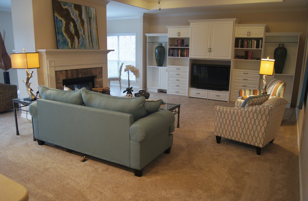 Inspiration for a large timeless open concept carpeted and beige floor family room remodel in Little Rock with beige walls, a standard fireplace, a brick fireplace and a media wall