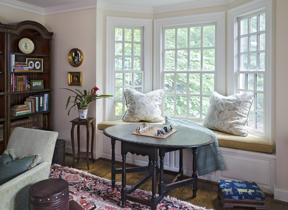 Inspiration for a victorian dark wood floor family room remodel in Richmond with beige walls
