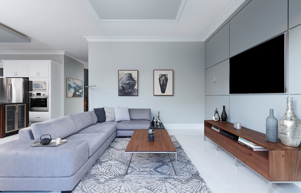 Источник вдохновения для домашнего уюта: открытая гостиная комната в современном стиле с серыми стенами, телевизором на стене и серым полом