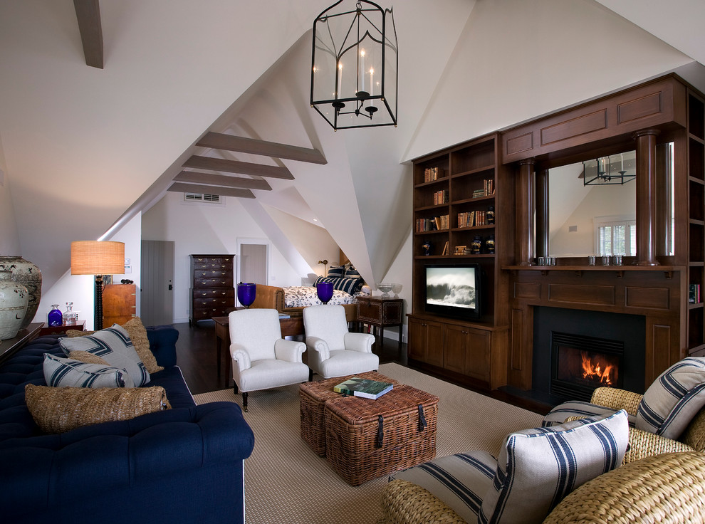Mid-sized cottage open concept dark wood floor family room photo in Santa Barbara with white walls, a standard fireplace, a media wall and a wood fireplace surround