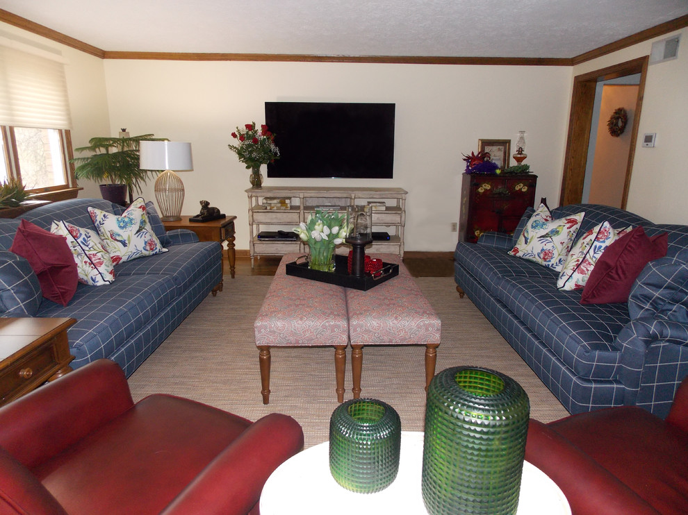Example of a mid-sized farmhouse enclosed family room design in Other with a wall-mounted tv