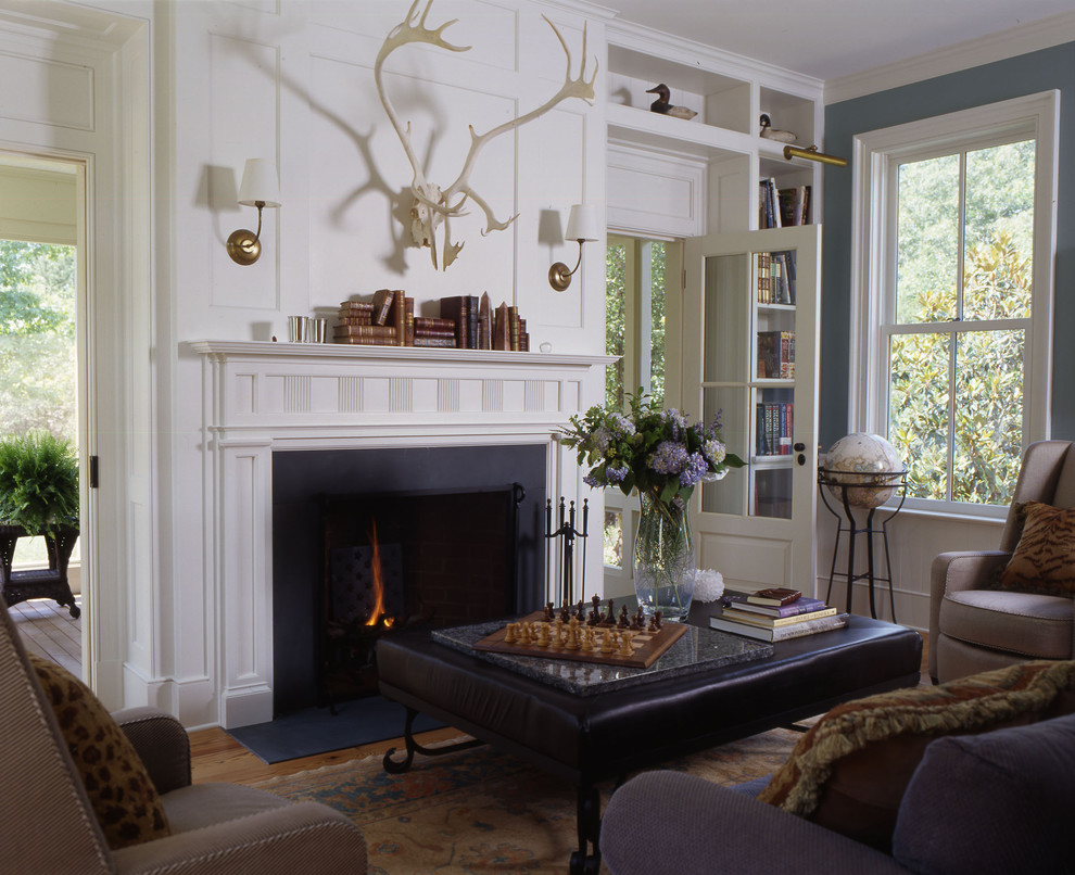 Inspiration for a classic enclosed games room in DC Metro with a standard fireplace, no tv and blue walls.