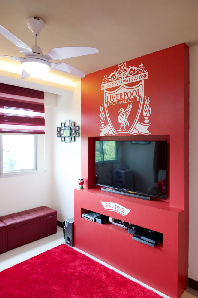 Diseño de sala de juegos en casa actual con paredes rojas y pared multimedia