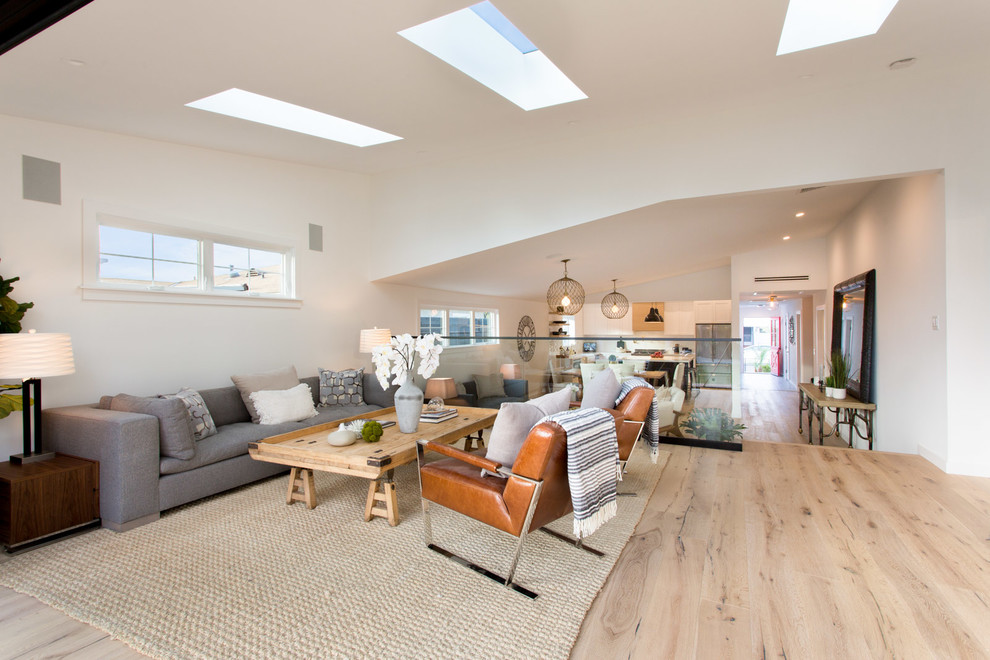 Family room - mid-sized farmhouse open concept family room idea in Los Angeles with white walls