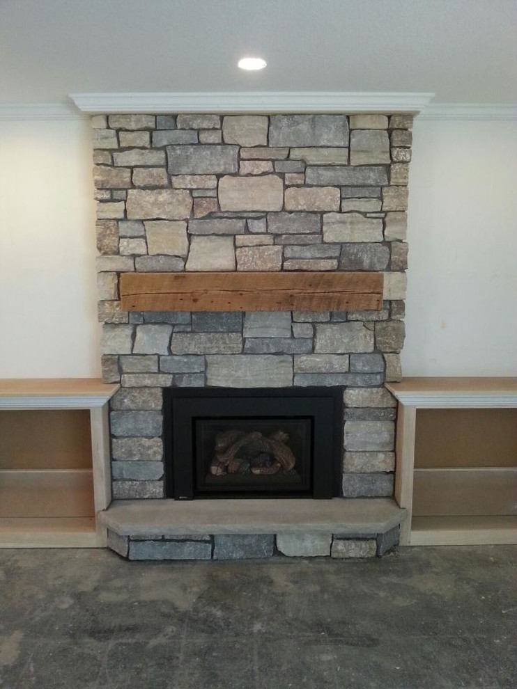 Photo of a medium sized rustic open plan games room in Minneapolis with white walls, a standard fireplace and a stone fireplace surround.