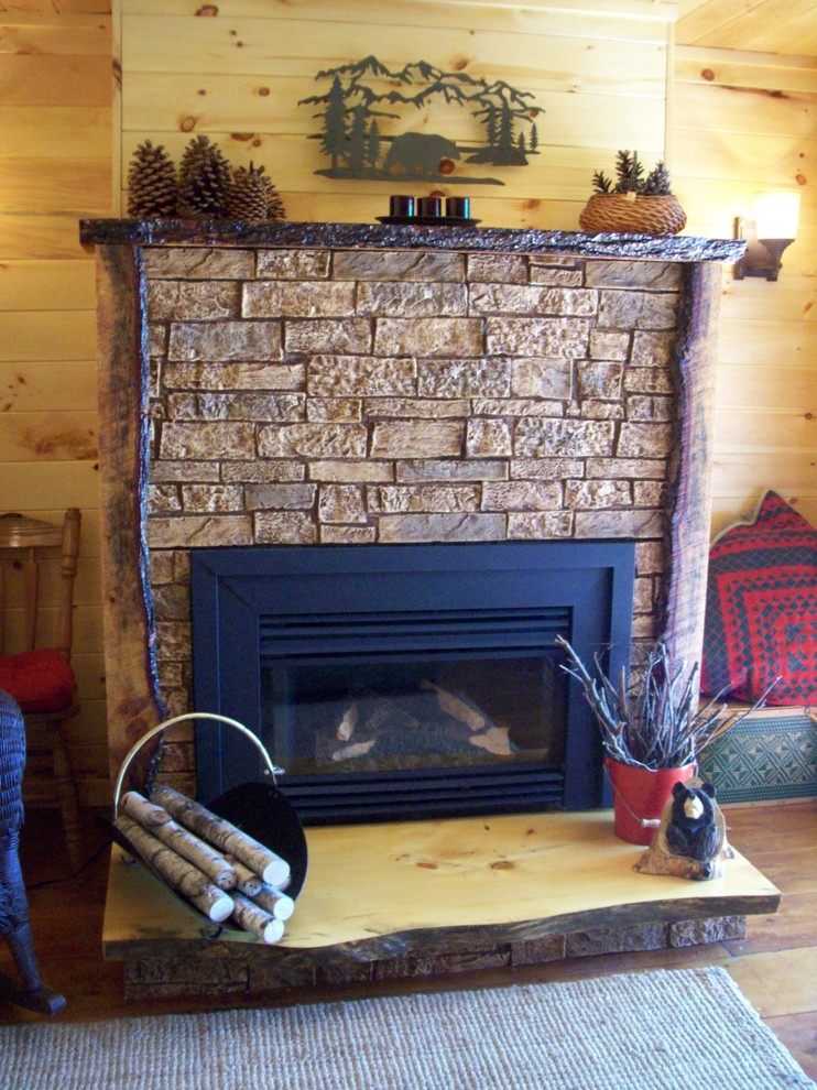 Example of a mid-sized mountain style enclosed medium tone wood floor family room design in Charlotte with brown walls, a standard fireplace and a stone fireplace