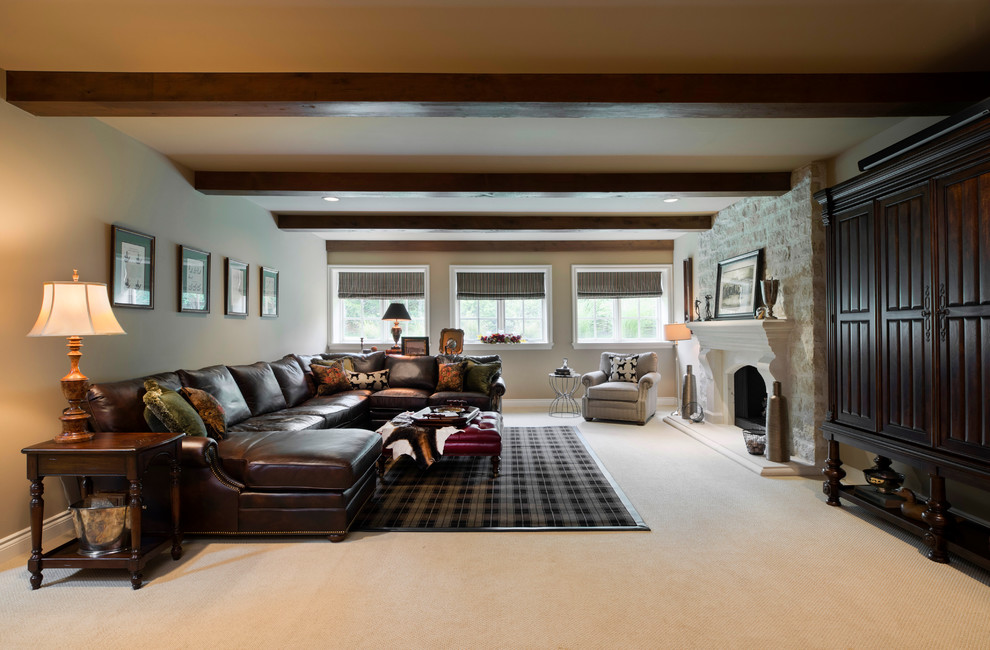 Family room - large traditional enclosed carpeted and beige floor family room idea with beige walls, a standard fireplace, a stone fireplace and a concealed tv