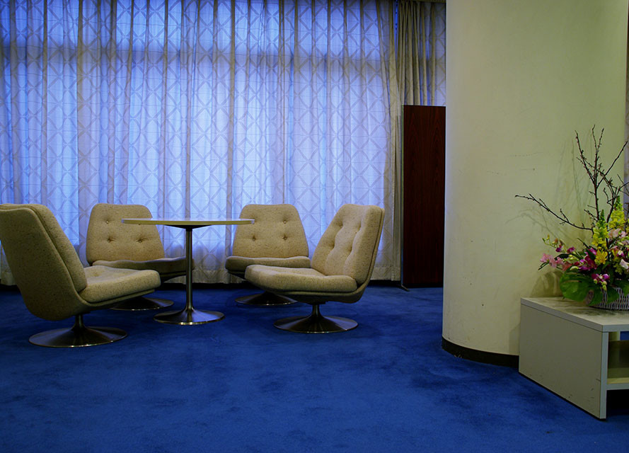 This is an example of a medium sized traditional games room in Other with beige walls and carpet.