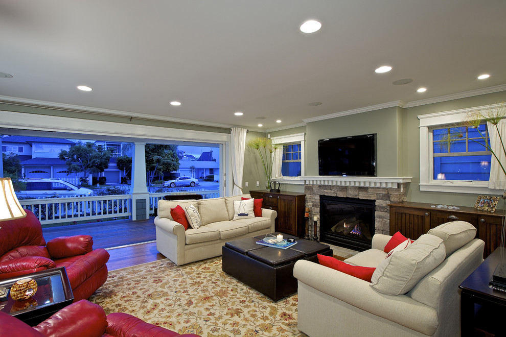 Inspiration for a classic games room in San Diego with a stone fireplace surround.