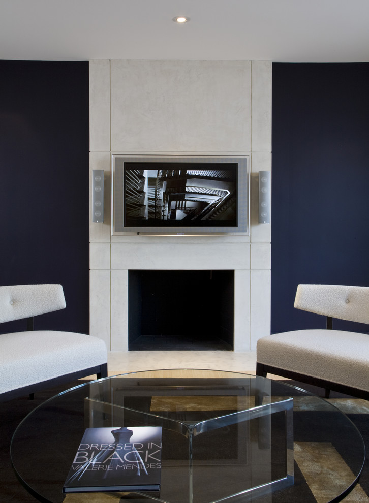 Example of a trendy family room design in DC Metro with a standard fireplace, a wall-mounted tv and blue walls