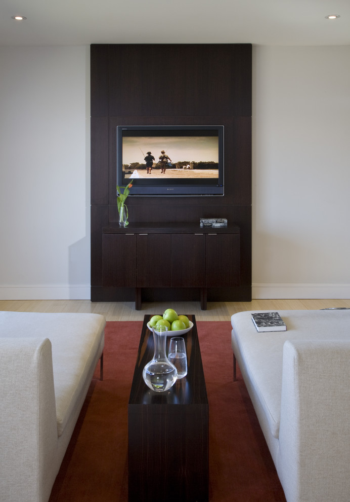 Photo of a contemporary games room in DC Metro with light hardwood flooring.