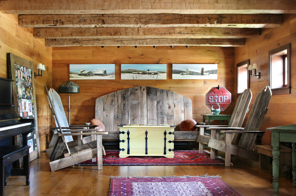 Family room - mid-sized cottage enclosed medium tone wood floor family room idea in New York with brown walls