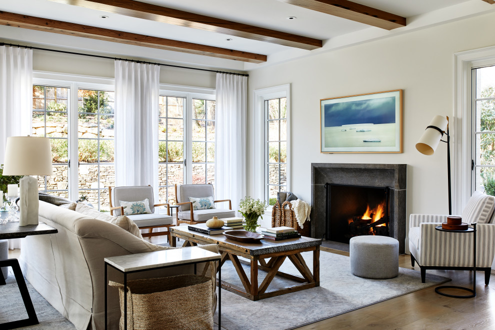 Inspiration for a large transitional open concept medium tone wood floor and brown floor family room remodel in DC Metro with white walls, a standard fireplace, a stone fireplace and a wall-mounted tv