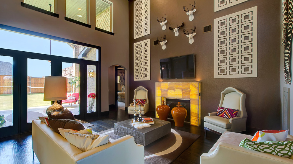 Trendy open concept dark wood floor family room photo in Dallas with brown walls, a standard fireplace and a wall-mounted tv