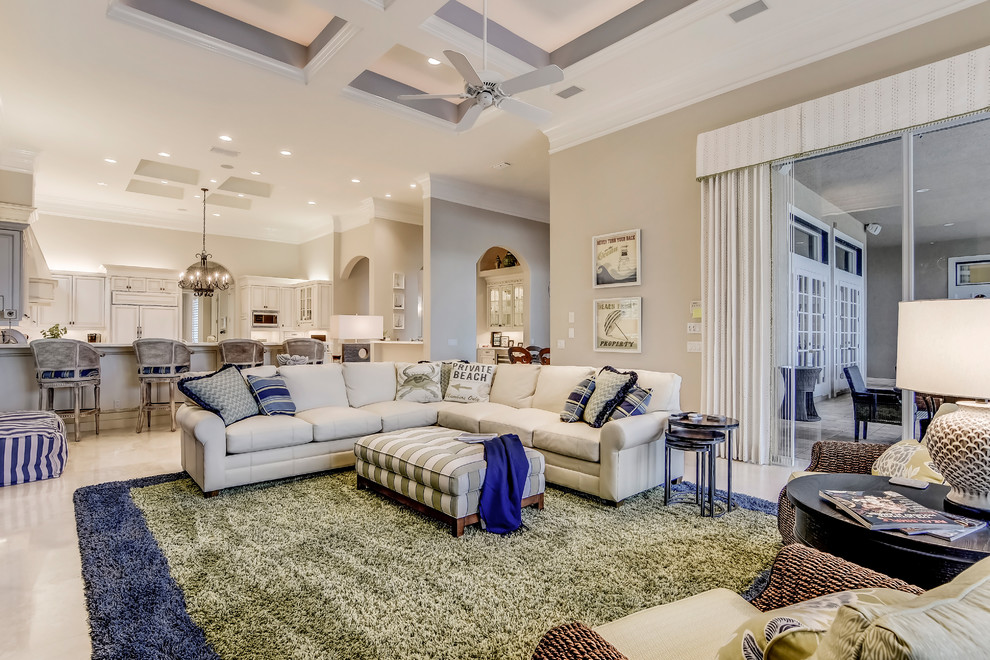 Example of a large transitional open concept marble floor family room design in Miami with beige walls, no fireplace and a media wall