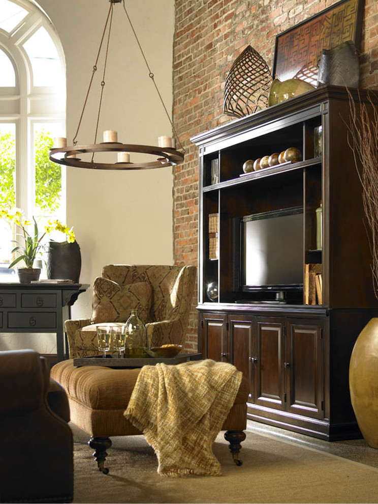Inspiration for a rustic family room remodel in Charlotte with beige walls and a tv stand