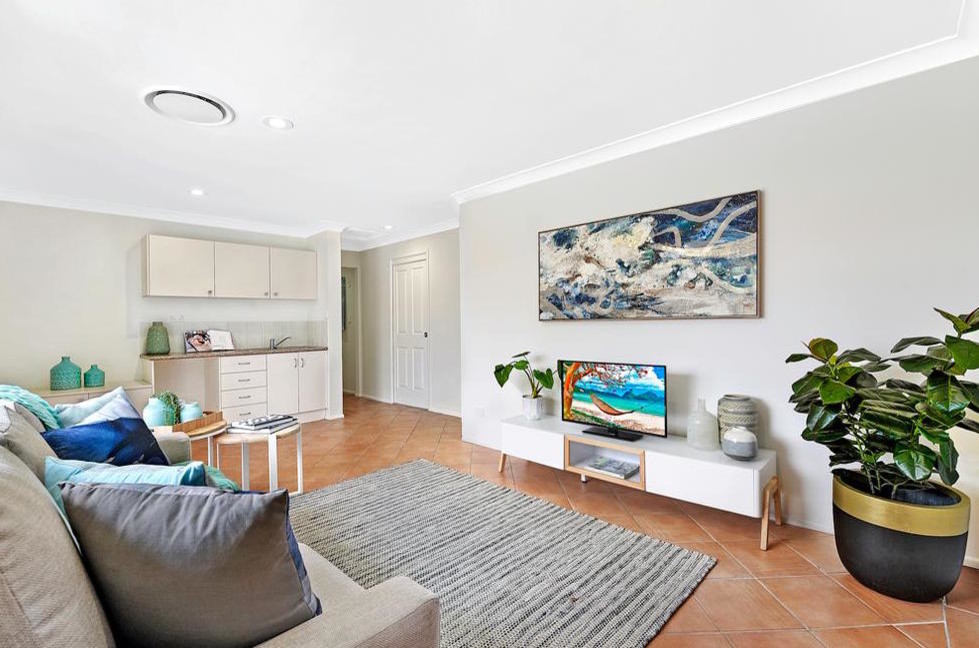 Example of a mid-sized beach style open concept terra-cotta tile and orange floor family room design in Gold Coast - Tweed with gray walls