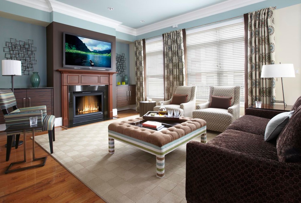 Family room - transitional dark wood floor family room idea in DC Metro with blue walls, a standard fireplace and a wall-mounted tv