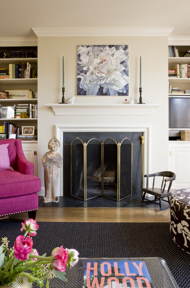 Traditional living room in DC Metro with beige walls, medium hardwood flooring and a standard fireplace.