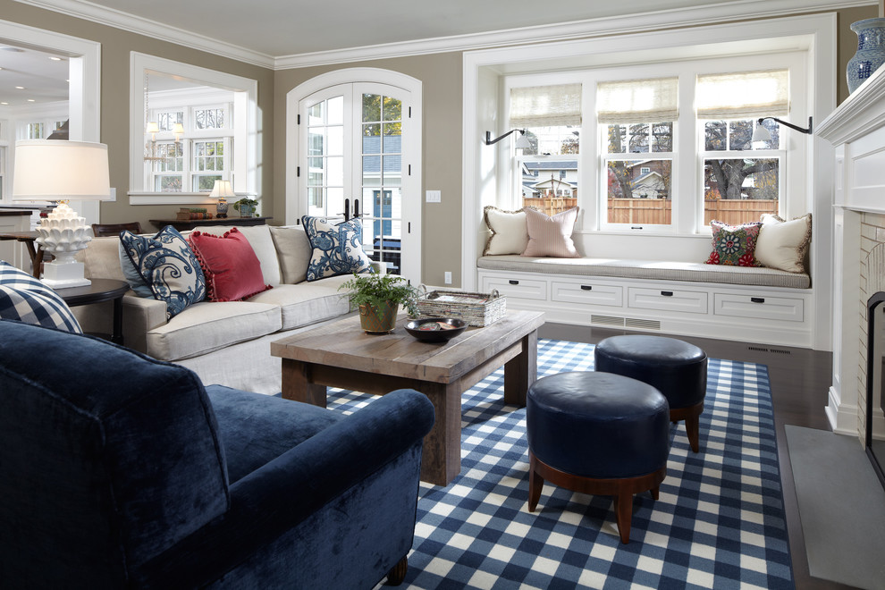 Elegant dark wood floor and brown floor family room photo in Minneapolis with beige walls and a standard fireplace