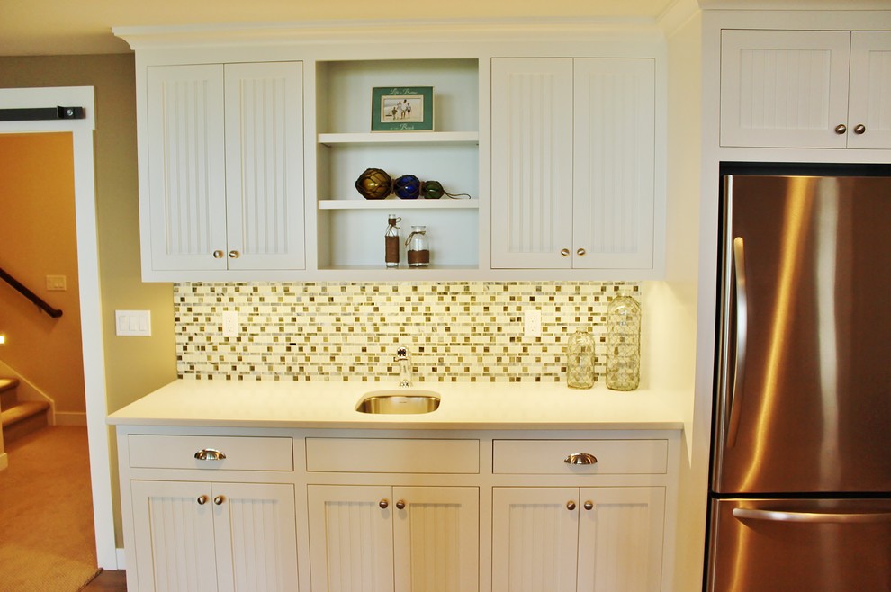 Inspiration for a coastal ceramic tile family room remodel in Grand Rapids with beige walls