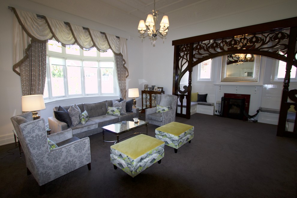 Example of a large classic carpeted and brown floor family room design in Melbourne with white walls, a standard fireplace and a concrete fireplace