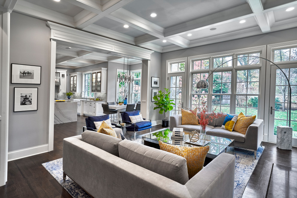 Inspiration for a mid-sized transitional open concept medium tone wood floor and coffered ceiling family room remodel in Chicago with gray walls